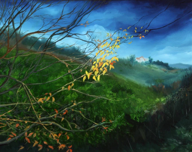 Golden leaves catch the light on a dark branch above rolling green hills.