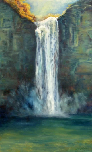 A high waterfall drops from sunlit rock into a green pool within a shaded gorge.