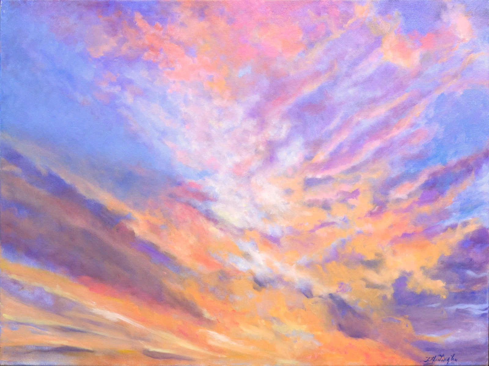 Pink, violet, gold, and orange clouds spread across a wide evening sky.
