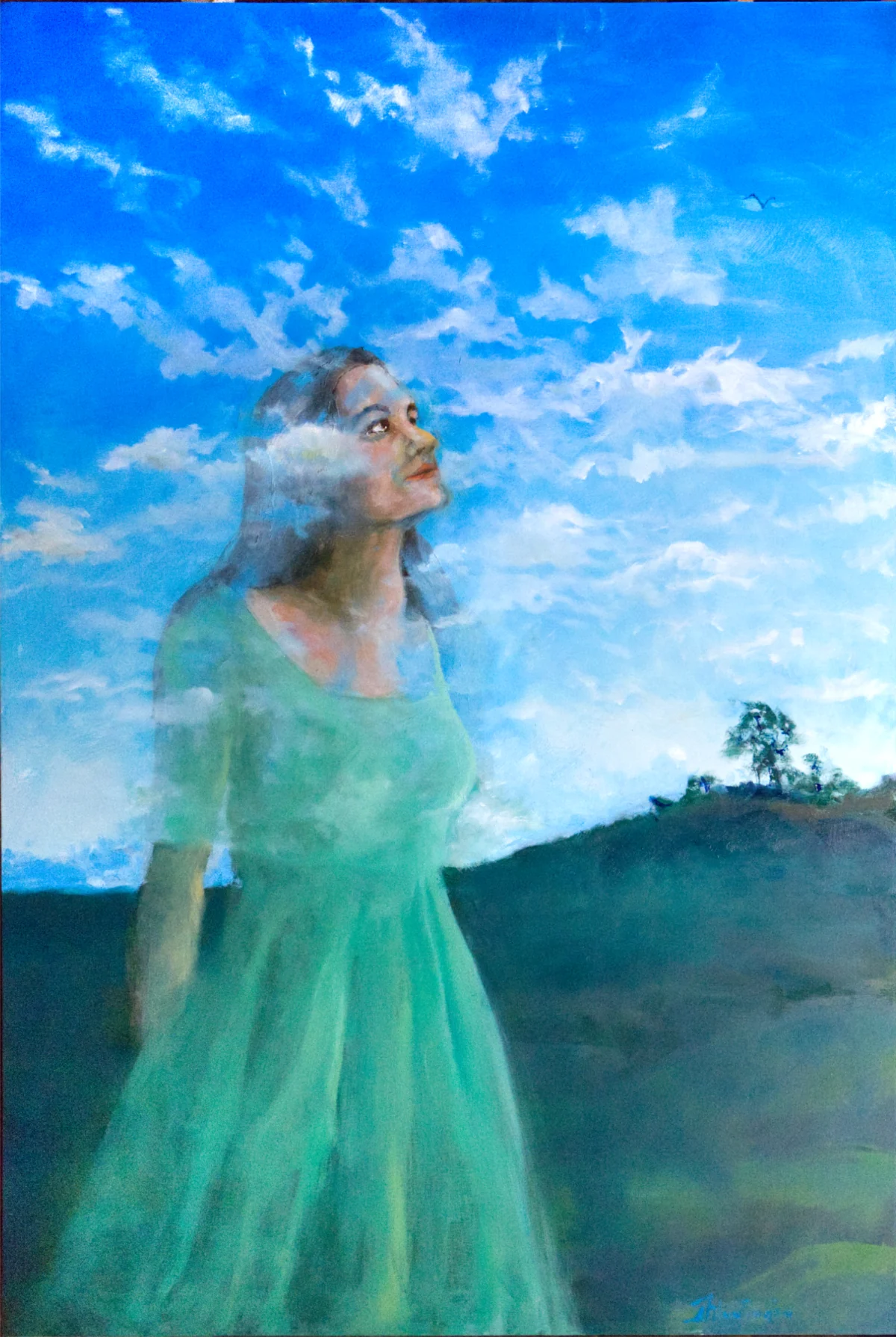 A woman in a green dress dissolves into a vivid blue sky and soft white clouds.